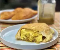  ??  ?? Harriett Aldridge’s Sopapilla stuffed with scrambled eggs and green salsa