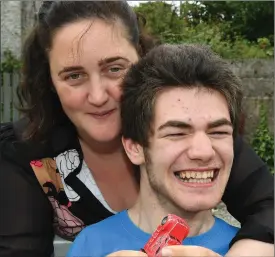  ??  ?? Castleisla­nd woman Nicola Lawless with her 19-year-old son Ben who requires constant care. The family’s request for respite was rejected by the HSE.