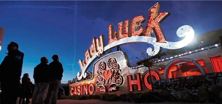  ?? — Photos: AP ?? Projectors light up non-working neon signs at an exhibit at the Neon Museum in Las Vegas.