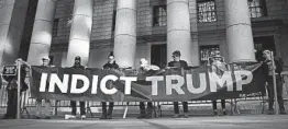  ?? DREW ANGERER/GETTY ?? Activists protest outside the federal court hearing on President Trump’s financial records