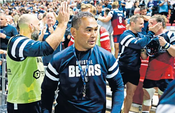  ??  ?? Job done: Pat Lam heads for the dressing room while the Bristol bench celebrates the victory over Bath on Friday night, which was sealed with Alapati Leiua’s late try (below) in front of a record crowd at Ashton Gate