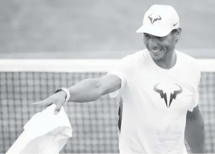  ?? Julian Finney, Getty Images ?? Spain’s Rafael Nadal has had a lot to smile about entering his fourth-round match at Wimbledon on Monday. Nadal is the reigning French Open champion; he didn’t lose a set while winning the tournament in Paris for the 10th time.