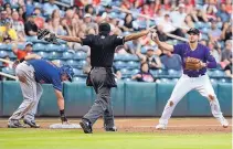  ?? ROBERTO E. ROSALES/ JOURNAL ?? Albuquerqu­e third baseman Josh Fuentes tries to persuade an umpire to change his safe call during the Isotopes’ win over Round Rock on Friday.