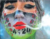  ??  ?? In this file photo, Ana Mendez Casteneda smokes marijuana outside the Senate in Mexico City.