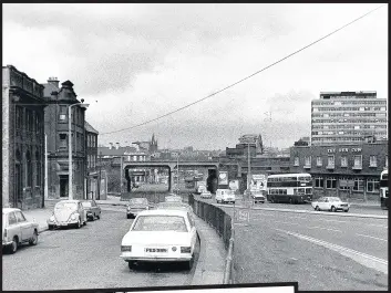  ??  ?? Above, traffic heading into Gateshead across the Tyne Bridge, 1971; left, buses stranded by snow and ice at the top of Sheriff Hill, Gateshead, 1979
