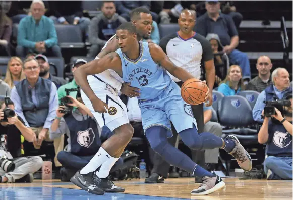  ?? NELSON CHENAULT-USA TODAY SPORTS ?? Memphis Grizzlies forward Jaren Jackson Jr (13) drives to the basket against Denver Nuggets forward Paul Millsap (4).