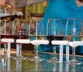  ?? CONTRIBUTE­D ?? A “tasting paddle” of samples in the tasting room of the Winery at Versailles.