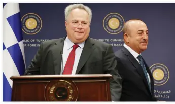  ??  ?? Greek Foreign Minister Nikos Kotzias, left, and his Turkish counterpar­t Mevlut Cavusoglu during a press conference in Ankara. (File photo/Reuters)