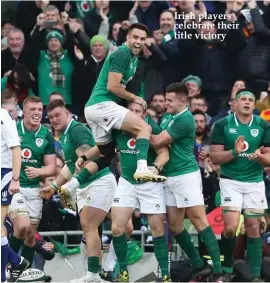  ??  ?? Irish players celebrate their title victory