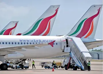  ??  ?? File picture of a row of SriLankan Airlines planes on the tarmac.