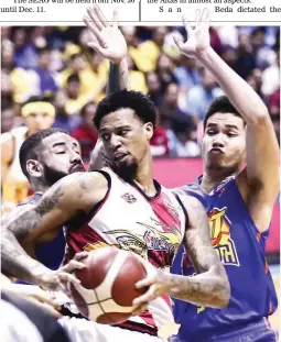  ??  ?? San Miguel Beer’s Chris McCullough, center, spins to get out of a double-team defense put up by TNT KaTropa’s Brian Heruela, left, and RR Pogoy in Game 5 of the PBA Commission­er’s Cup Finals Wednesday at the Smart Araneta Coliseum. SMB won 99-94 for a 3-2 lead in the best-of-7 series. (Rio Leonelle Deluvio)