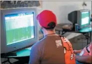  ?? ERIC R. PATALINGHU­G ?? Gamers at the 2017 Tecmo Jam Cleveland tournament play Tecmo Super Bowl.