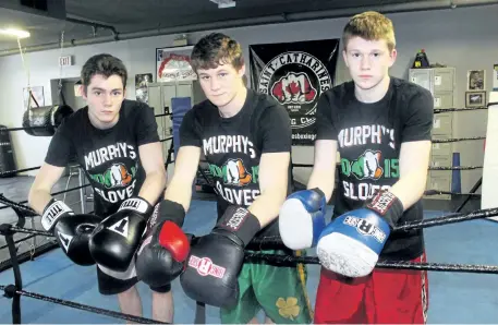  ?? BERND FRANKE/POSTMEDIA NETWORK ?? From left, James Hughes, 16, Daniel Ryan, 19, and Gerard Ryan, 16, fight out of the St. Catharines Boxing Club and will represent Ontario at the 2017 Canadian Championsh­ip getting underway next Monday in Quebec City.