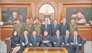  ??  ?? Photo shows Kim (centre) posing with newly-elected members of the leadership bodies of the state at the headquarte­rs building of the Party Central Committee in Pyongyang. — AFP photo