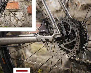  ??  ?? RIGHT Flat-mounts for the disc brakes and a multitude of fittings
BELOW Shimano’s MT210 chainset: superior stiffness over its rivals