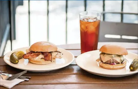  ?? PHOTOS BY MIA YAKEL ?? The Funky Chicken sandwich and The Burger are favorites at Muss &amp; Turner’s.