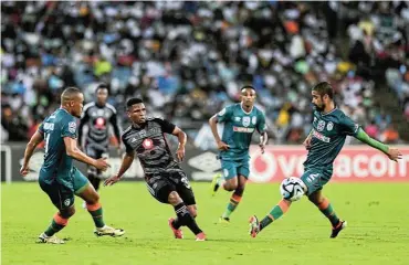  ?? Picture: Darren Stewart/Gallo Images ?? Thabiso Sesane of Orlando Pirates fights for the ball with AmaZulu FC players during their Nedbank Cup quarterfin­al match at Moses Mabhida Stadium in Durban yesterday. Pirates won the game 4-2 to reach the semifinals.