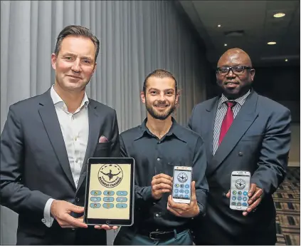  ?? Picture: WERNER HILLS ?? GOING DIGITAL: At the launch of the Nelson Mandela Bay Business Chamber’s mobile app last night were, from left, chamber president Thomas Schaefer, Matthew Alexandre, of AppyTown, and acting chamber chief executive Prince Matonsi