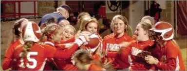  ?? MARK HUMPHREY ENTERPRISE-LEADER ?? Farmington softball players swarm senior shortstop Bethany Doty after she blasted a home run versus Pottsville.