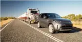  ??  ?? Land Rover Discovery pulling a road train.