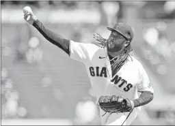  ?? JEFF CHIU — THE ASSOCIATED PRESS ?? Giants pitcher Johnny Cueto throws during the first inning against the Reds on Wednesday.