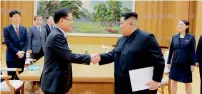  ?? AP ?? Kim Jong-un, front right, shakes hands with South Korean National Security Director Chung Eui-yong in Pyongyang. —