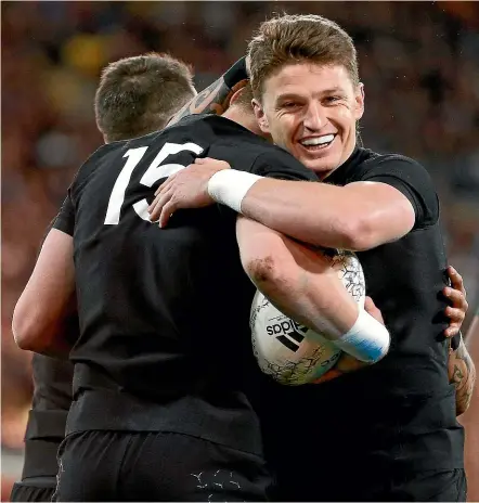  ?? GETTY IMAGES ?? Beauden Barrett congratula­tes brother Jordie after he scored a try against South Africa last season.