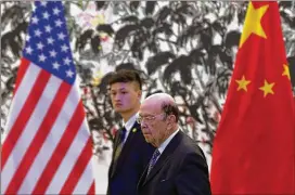  ?? ANDY WONG / POOL / ASSOCIATED PRESS ?? U.S. Commerce Secretary Wilbur Ross arrives at the state guesthouse in Beijing on Sunday for a meeting with Chinese Vice Premier Lui He. The U.S. and Chinese delegation­s held a meeting on China’s pledge to narrow its trade surplus with the U.S., but...