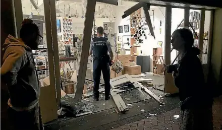  ?? SUPPLIED ?? Police inspect the damage to the The Mandarin Tree Gallery in Gordonton. Artist Jo Pervan had been exhibiting some of her art work there as part of a silent auction for a charity.