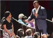  ?? DANA JENSEN THE DAY ?? Former NBA star Earvin “Magic” Johnson answers a question during his motivation­al talk at the Fox Theater at Foxwoods on Tuesday.