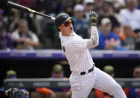  ?? David Zalubowski, The Associated Press ?? Rockies catcher Brian Serven files out against Mets relief pitcher Edwin Diaz to end the ninth inning Sunday at Coors Field.