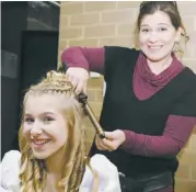  ??  ?? Below: Julie Whiteley helps her daughter Ruby with hair and makeup prior to the show.