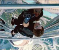  ?? PARAMOUNT PICTURES VIA ASSOCIATED PRESS ?? In this image released by Paramount Pictures, Tom Cruise as Ethan Hunt in a scene from “Mission: Impossible — Ghost Protocol.”