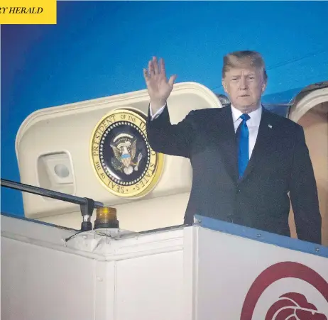  ?? SAUL LOEB / AFP / GETTY IMAGES ?? U.S. President Donald Trump waves after Air Force One arrives at Paya Lebar Air Base in Singapore on Sunday ahead of his planned meeting with North Korea’s leader Kim Jong Un. Trump used time on the plane to send tweets undoing work just accomplish­ed by G7 leaders in Quebec.