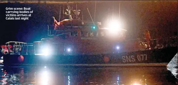  ?? ?? Grim scene: Boat carrying bodies of victims arrives at Calais last night