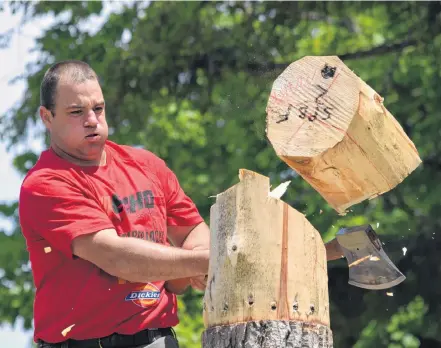  ??  ?? Mario Bourque sends the top of the block flying in the springboar­d competitio­n during the 2018 Nova Scotia Lumberjack Championsh­ips at Wild Axe Park in Barrington. The event is back in Barrington this summer, July 18-19. KATHY JOHNSON PHOTO