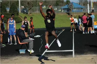  ?? The Sentinel-Record/James Leigh ?? ■ Hot Springs’ Alex Europe eyes the ground while participat­ing in the long jump in the Lakeside Ram Relays Thursday. Europe won the event with a distance of 20 feet, 5 inches.