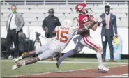  ?? MICHAEL AINSWORTH — THE ASSOCIATED PRESS ?? Oklahoma wide receiver Drake Stoops, left, scores the winning touchdown in overtime as Texas defensive back Chris Brown tries to tackle him Saturday in Dallas.