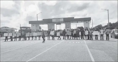  ??  ?? Berbice Bridge Company workers protesting for safety gear and pay raises yesterday