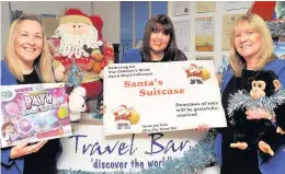  ??  ?? Santa’s Suitcase Travel Bar sales manager, Allison Dow, office manager Laura Johnston and travel advisor, Jacqui Simpson, are collecting toys for children in hospital over the festive period