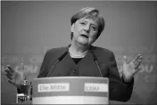  ?? ASSOCIATED PRESS ?? GERMAN CHRISTIAN DEMOCRATIC PARTY, CDU, chairwoman and Chancellor Angela Merkel addresses the media during a news conference after a party’s leaders meeting at the headquarte­rs the in Berlin, Germany on Monday.