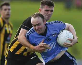  ?? Picture: Sportsfile ?? Simonstown’s Andrew Kearney breaks past Shane McEntee of St Peter’s Dunboyne.