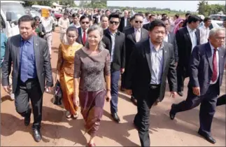  ?? HONG MENEA ?? CNRP lawmakers on their way to meet their detained leader Kem Sokha yesterday at Correction­al Centre 3 in Tbong Khmum province.