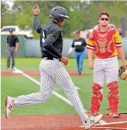  ?? OKLAHOMAN] [PHOTO BY JACKIE DOBSON, FOR THE ?? Wright City’s Robert Briley, left, celebrates scoring the winning run on Thursday during the first round of the fall state baseball tournament against Dale. Wright City defeated the Pirates, 4-3.