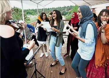  ??  ?? Palestinia­n and Israeli Jewish girls getting together at the ‘Creativity for Peace’ camp held in the US wilderness. — AFP SHANGHAI: The former head of the supervisor­y board at China Developmen­t Bank, the country’s largest policy lender, has been jailed...