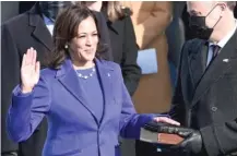 ?? BRENDAN SMIALOWSKI/AFP VIA GETTY IMAGES ?? Kamala Harris, flanked by her husband, Doug Emhoff, is sworn in as vice president of the United States by Supreme Court Justice Sonia Sotomayor on Wednesday.