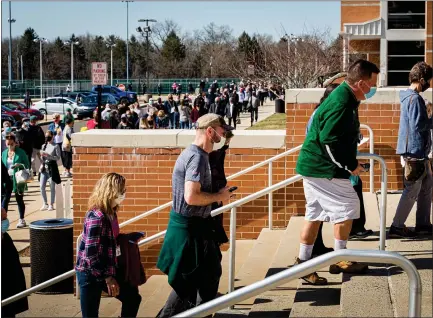  ?? PHOTO COURTESY BP MILLER/CHORUS PHOTOGRAPH­Y ?? People wait in line on Sunday outside of North Penn High School in Lansdale to receive a COVID-19vaccine as part of a pop=up vaccinatio­n clinic.