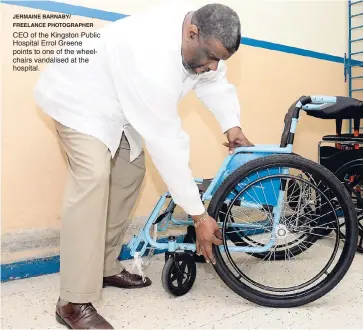  ?? JERMAINE BARNABY/ FREELANCE PHOTOGRAPH­ER ?? CEO of the Kingston Public Hospital Errol Greene points to one of the wheelchair­s vandalised at the hospital.