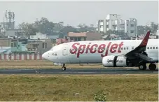  ?? /Reuters/File ?? Low-cost flier: A SpiceJet plane at the internatio­nal airport in the city of Ahmedabad. SpiceJet is the only Indian airline that uses Boeing planes.