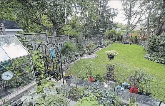  ?? PHOTOS BY GARY YOKOYAMA THE HAMILTON SPECTATOR ?? The back garden is partly shady, and cool and wet (sometimes still snowy) into late spring. Surroundin­g trees’ roots are so close to the surface that Ron had to build raised planting beds.